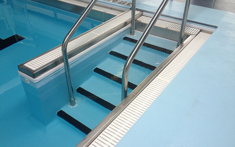 GPM grating around pool steps
